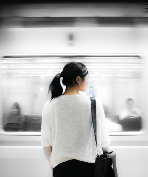 A girl and a train passing